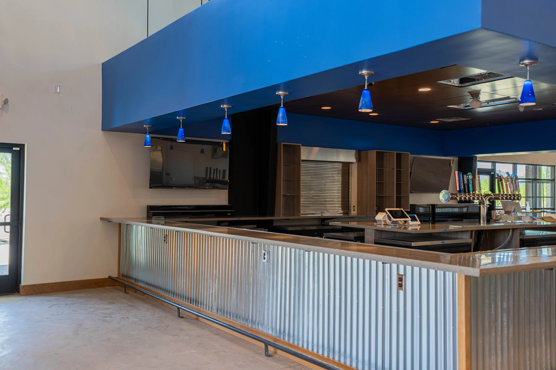 Finished bar with blue soffit and pendant lights