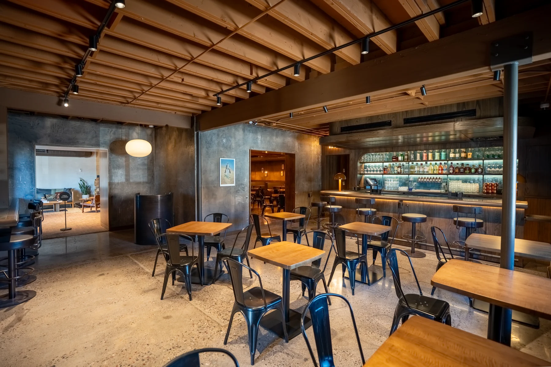 Restaurant bar with wood ceiling and stools