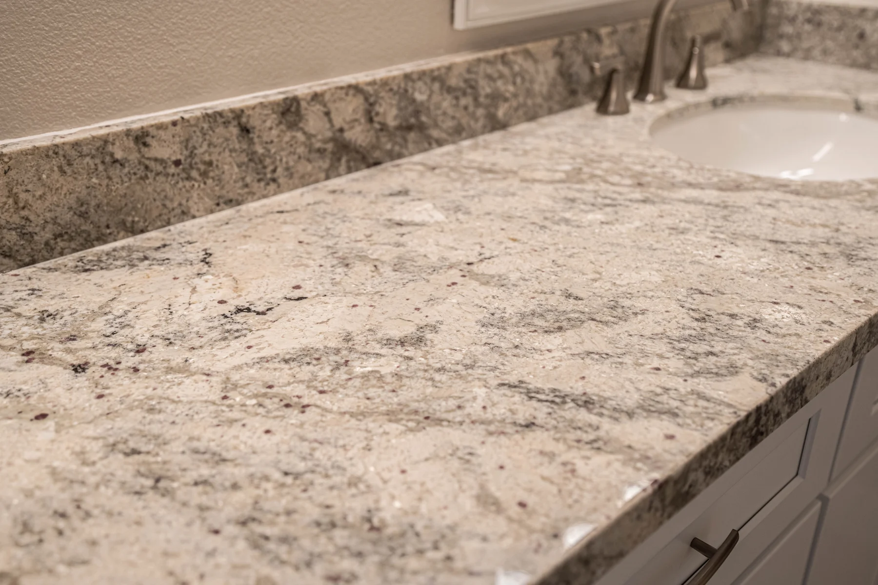 Close-up of a granite countertop and undermount sink